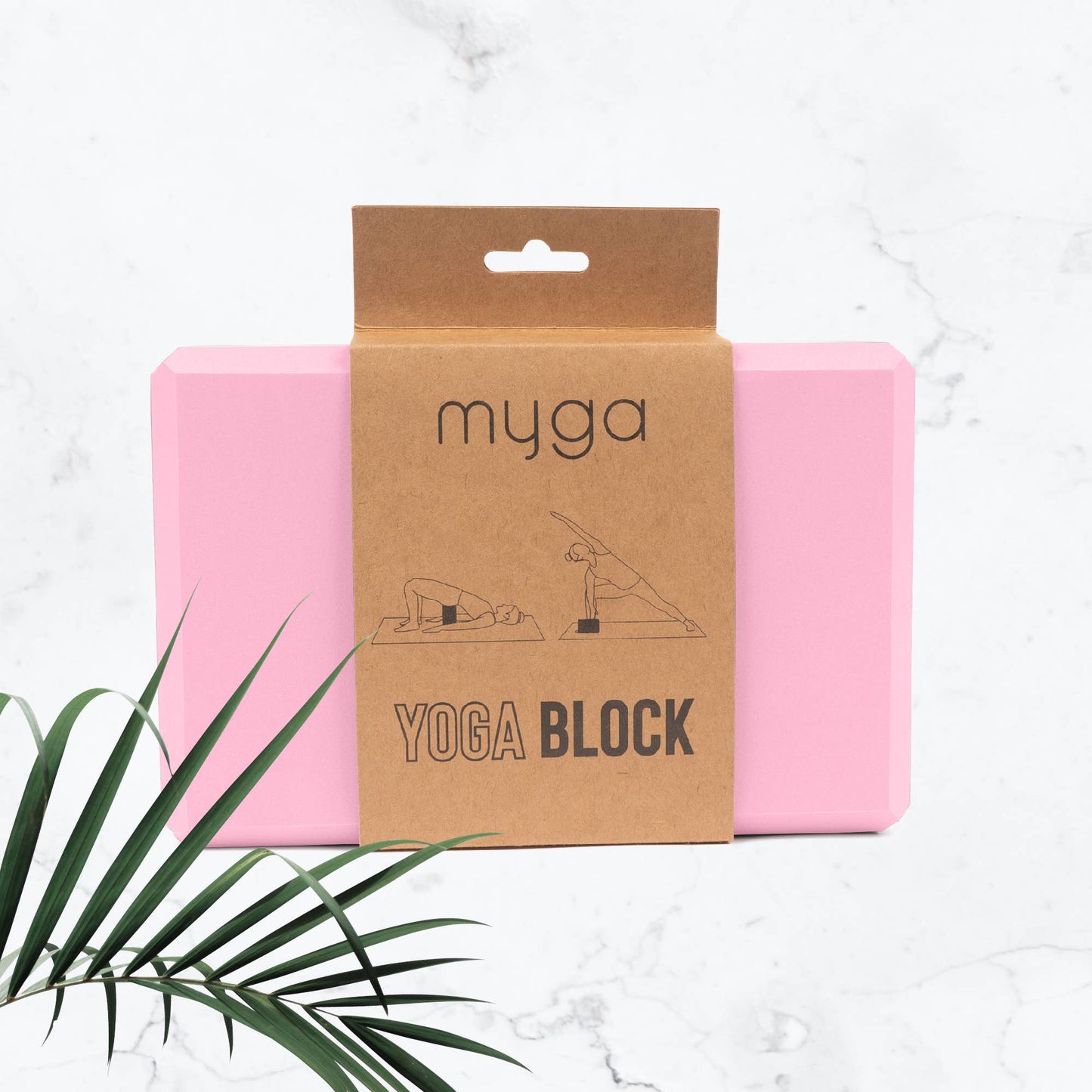 Pink yoga block with 'myga' branded packaging on a light background