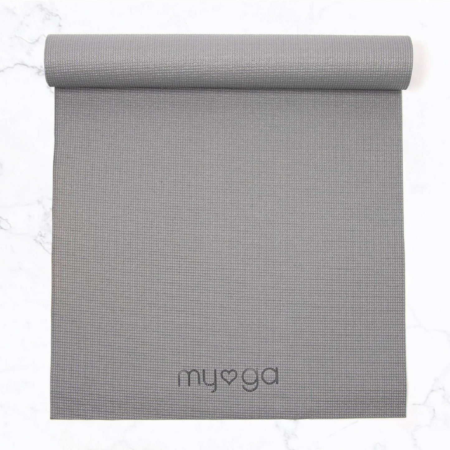Overhead view of a partially rolled, light grey Myga yoga mat. The mat has a textured surface and the Myga logo is embossed near the bottom, showing the full length and material detail.