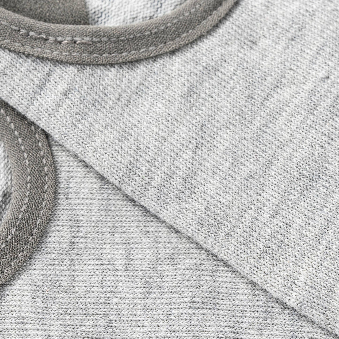 Close-up of a gray fabric with a logo patch