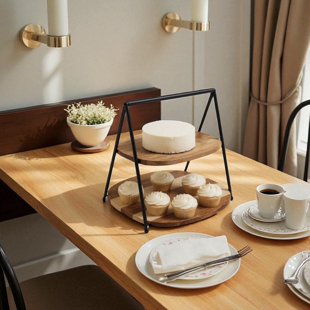 Acacia wood two-tier cake stand on a rustic kitchen table