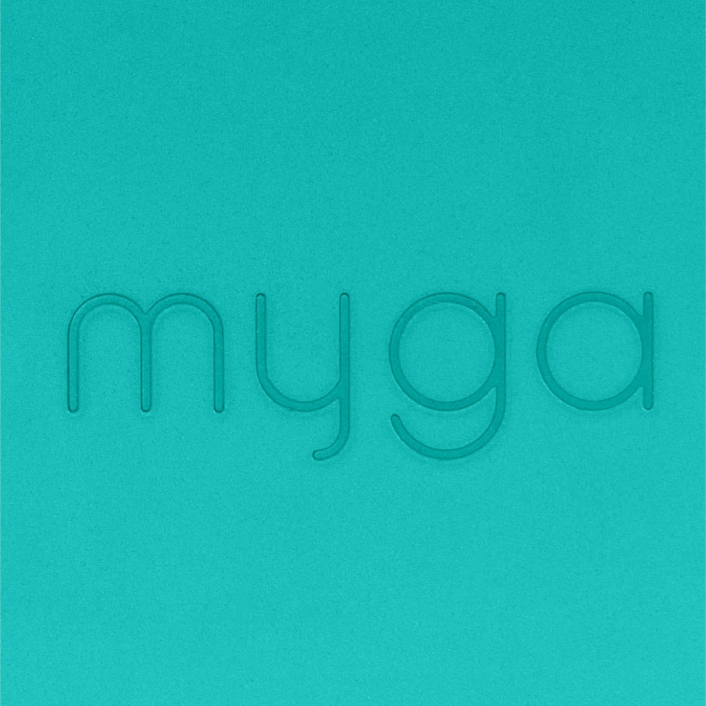 Extreme close up of myga Teal block background with 'myga' text