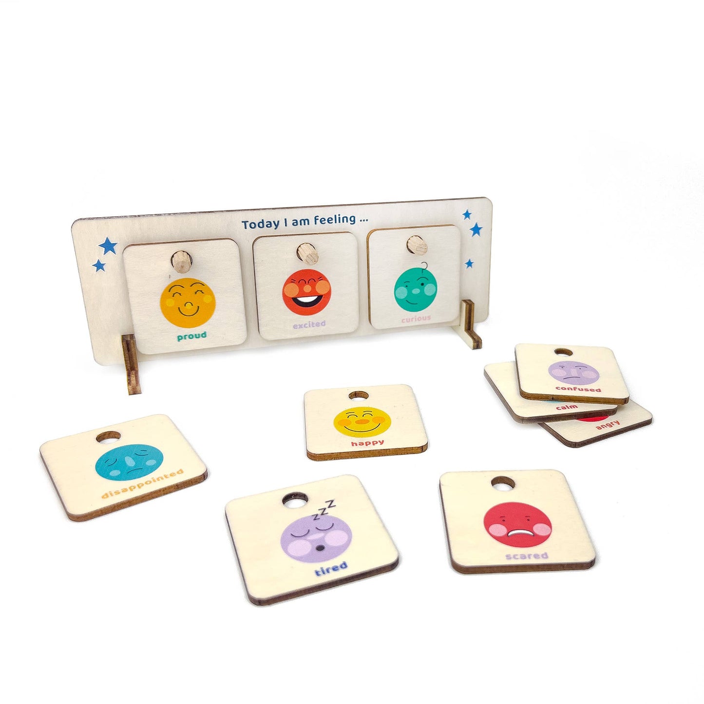 Wooden "Today I am Feeling" chart displaying 'proud,' 'excited,' and 'curious' tiles. Several additional emotion tiles are spread around the base, including 'disappointed,' 'happy,' 'tired,' 'scared,' 'confused,' 'calm,' and 'angry.' Educational social-emotional learning tool for children.